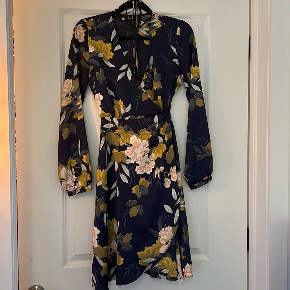 Long sleeved (polyester) dress.